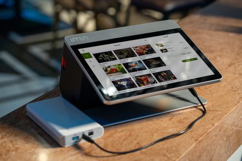 Free Touchscreen ordering system in a cafe showing food menu options on display. Stock Photo
