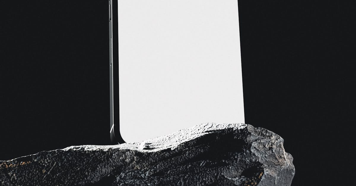 A Grayscale of a Smartphone on a Rock · Free Stock Photo