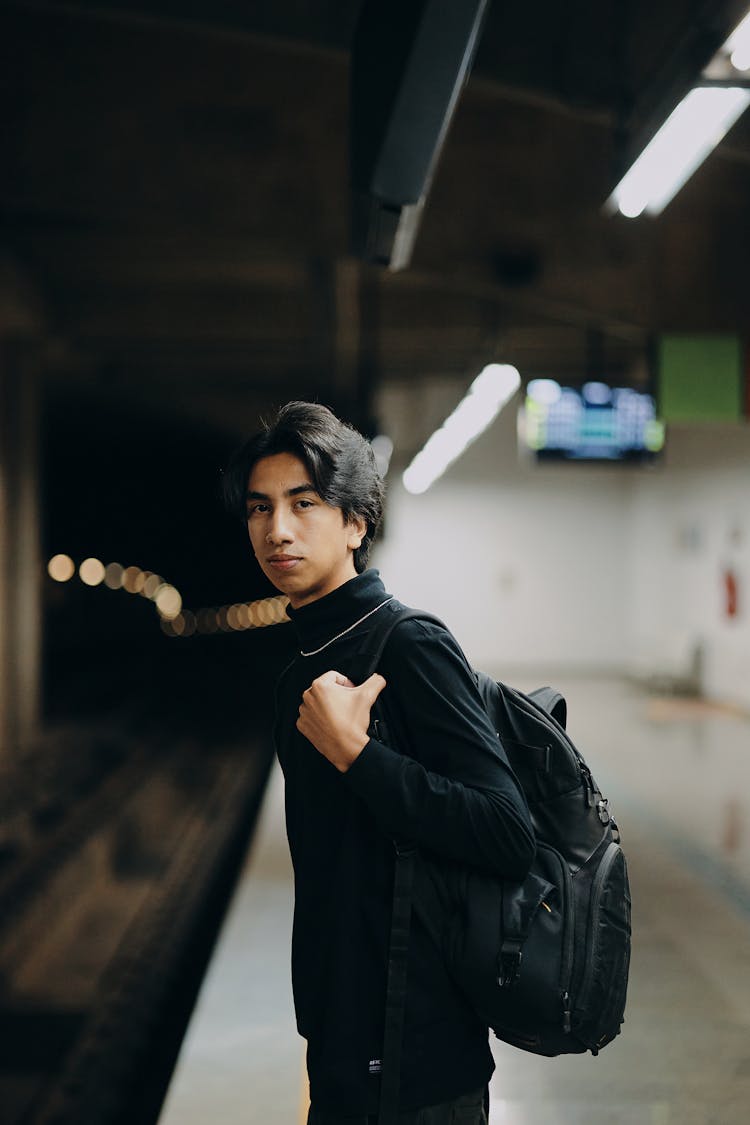 Man With Backpack Waiting For Train