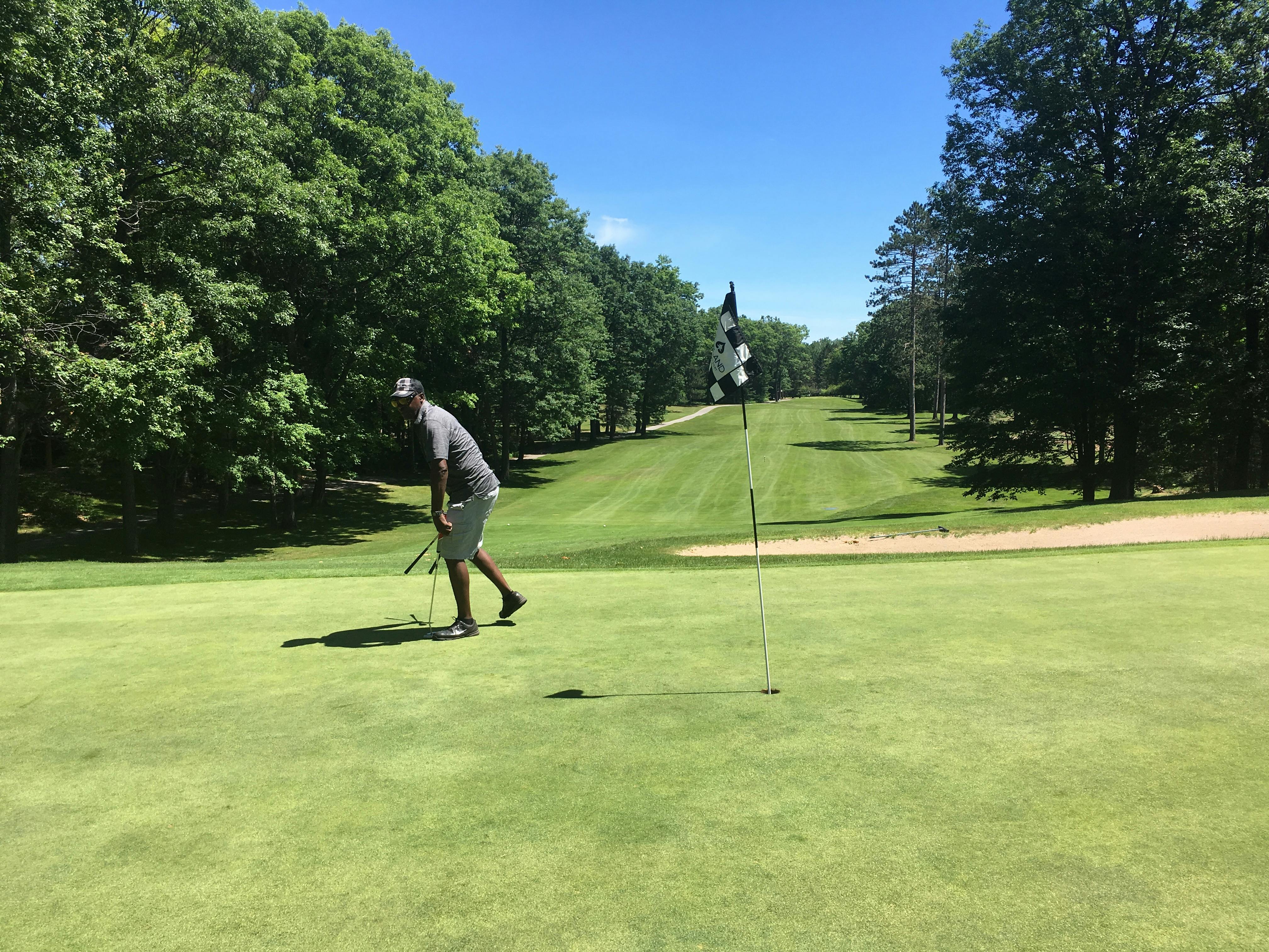 A close-up of a futuristic helmet, similar in style to Master Chief's iconic armor.