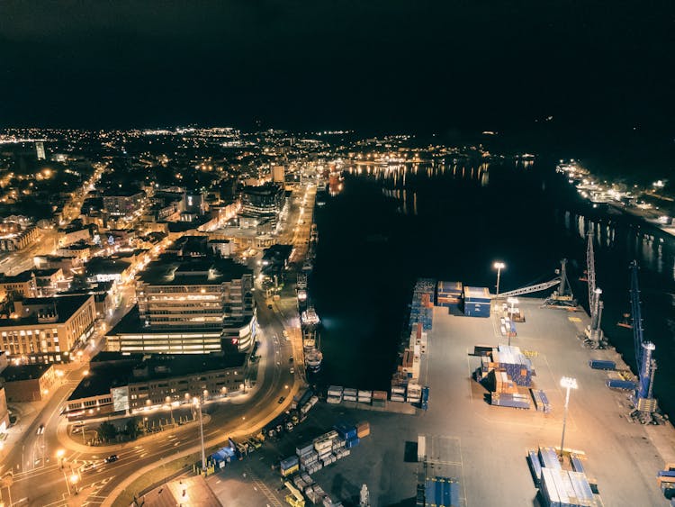 An Aerial Shot Of A Coastal City With A Port