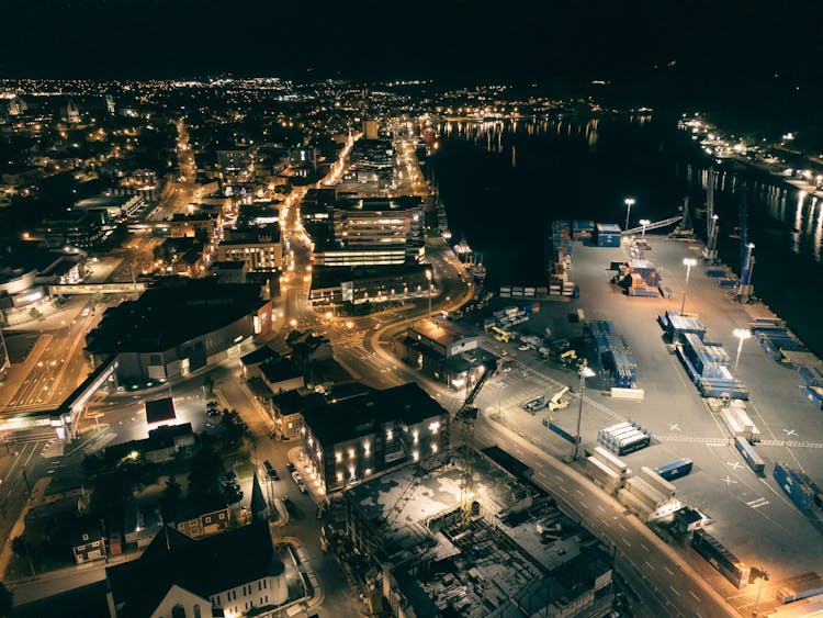 An Aerial Shot Of A Coastal City With A Port