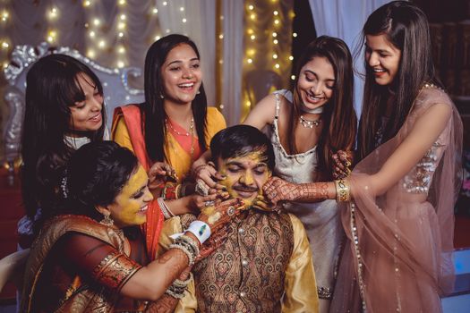 A Bride and Groom in a Haldi Ceremony