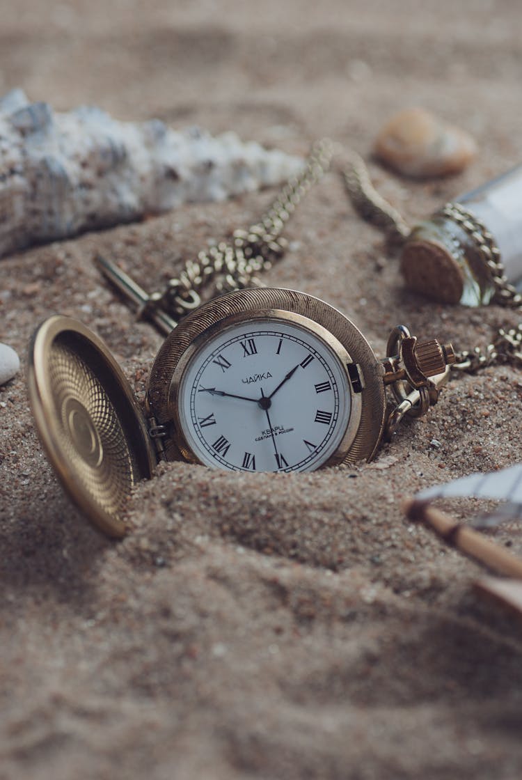 Golden Watch On Sand