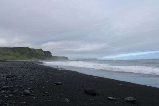 Discover the unique beauty of Iceland's black sand beaches with dramatic coastal views and moody skies.. pexels, discover, un