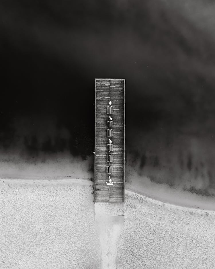 Drone Shot Of A Jetty Over Water