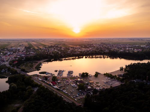 A Town Around a Lake During Sunset