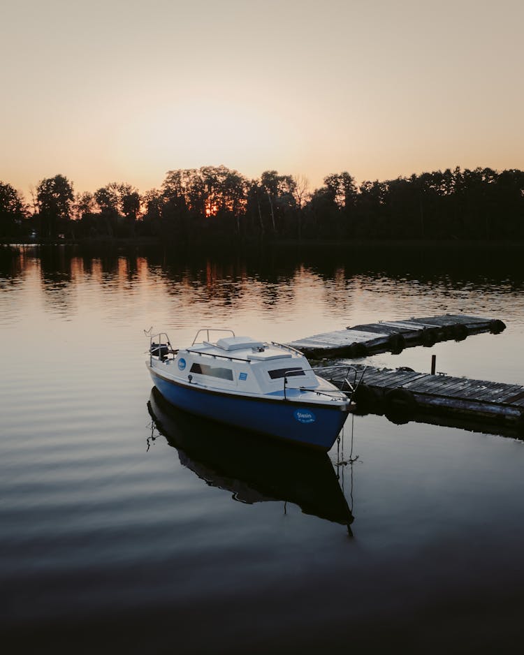 Boat By The Dock On The Lake