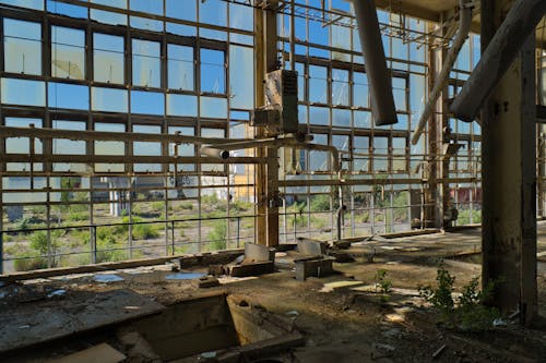 An Abandoned Industrial Building with Broken Glass Windows