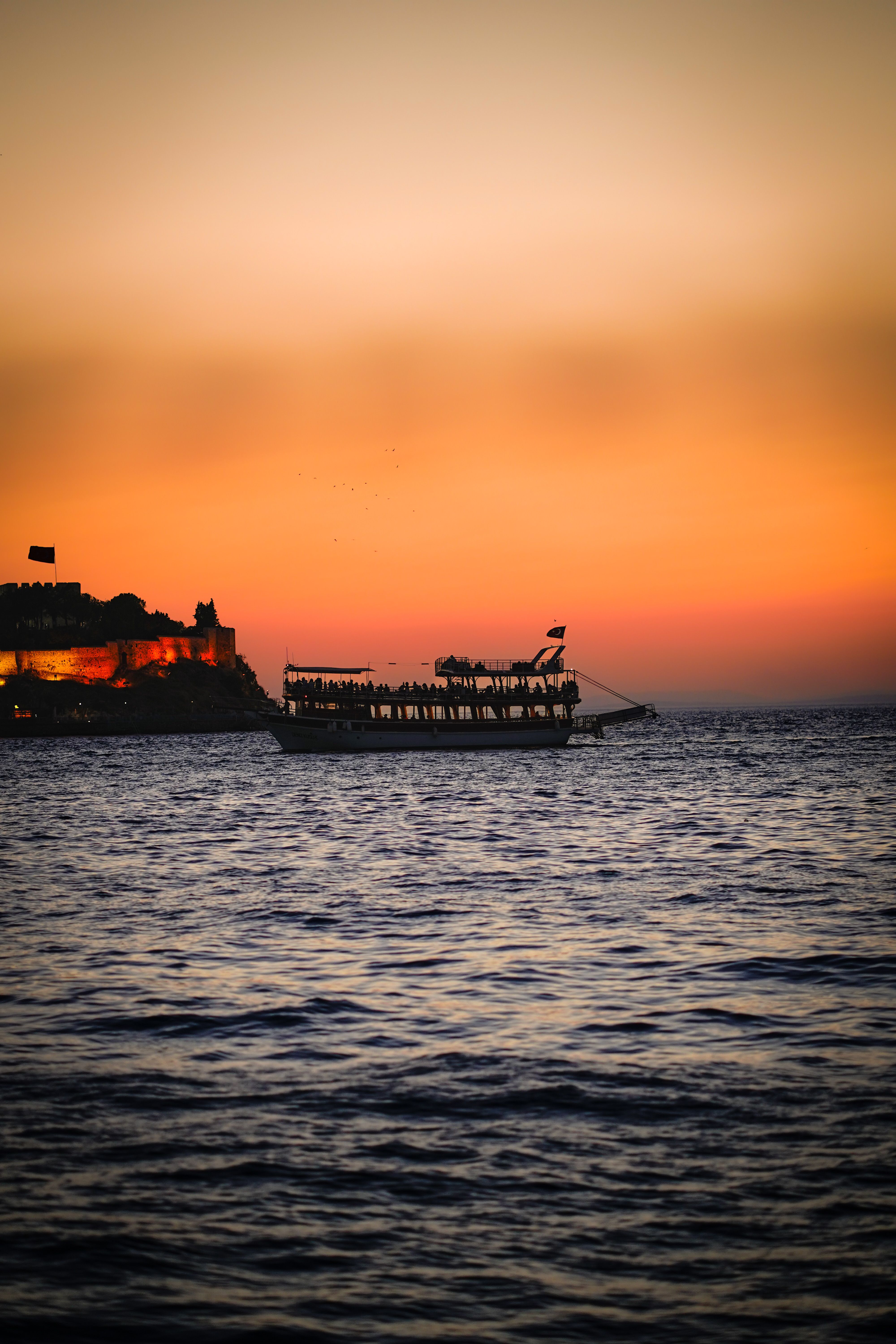 A Ferry Sailing on Sea during Sunset · Free Stock Photo
