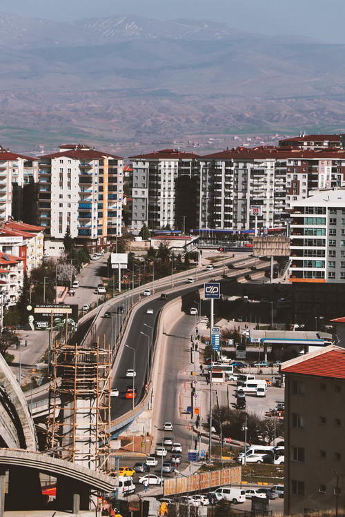 Free Drone shot capturing the busy urban skyline and traffic in Kırıkkale, Turkey. Stock Photo