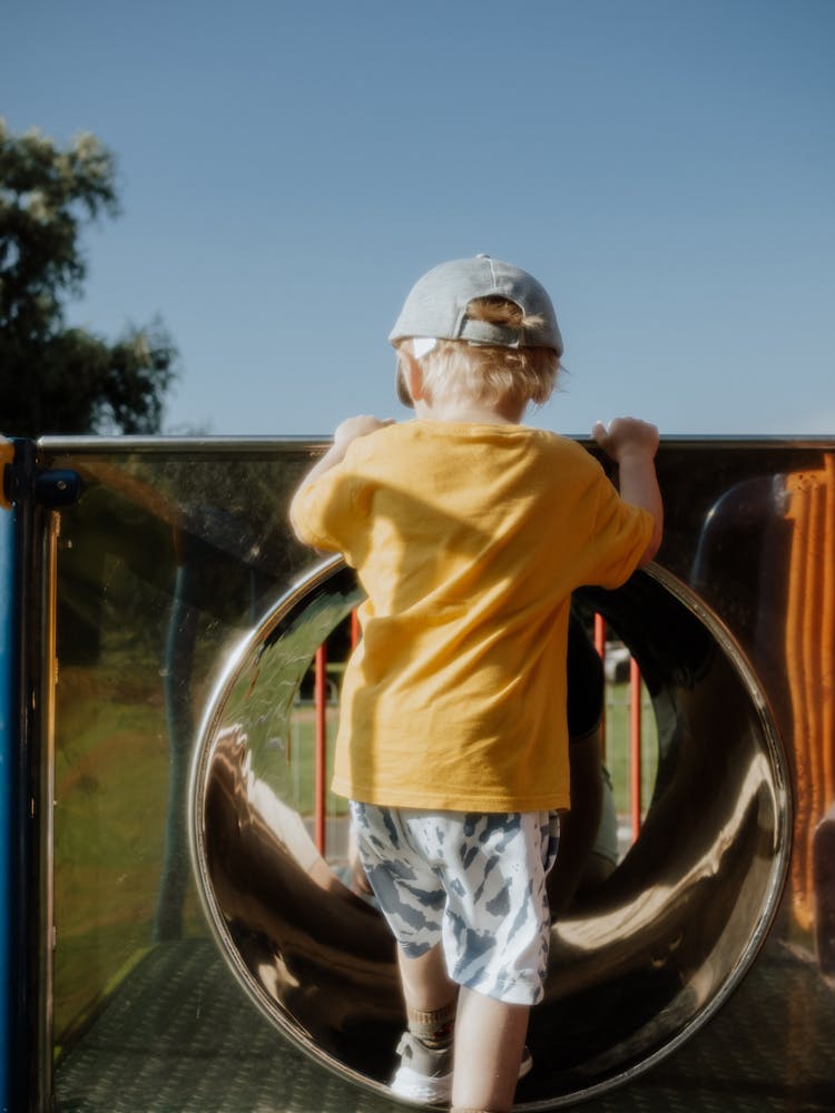 A Child Going In A Slide