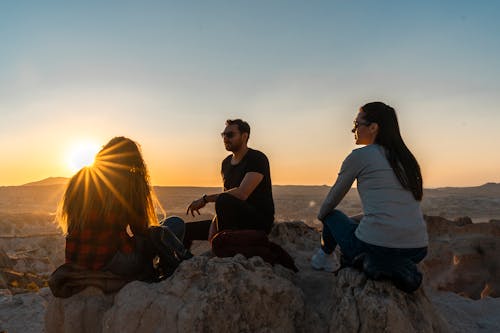 Friends Sitting on Rocks