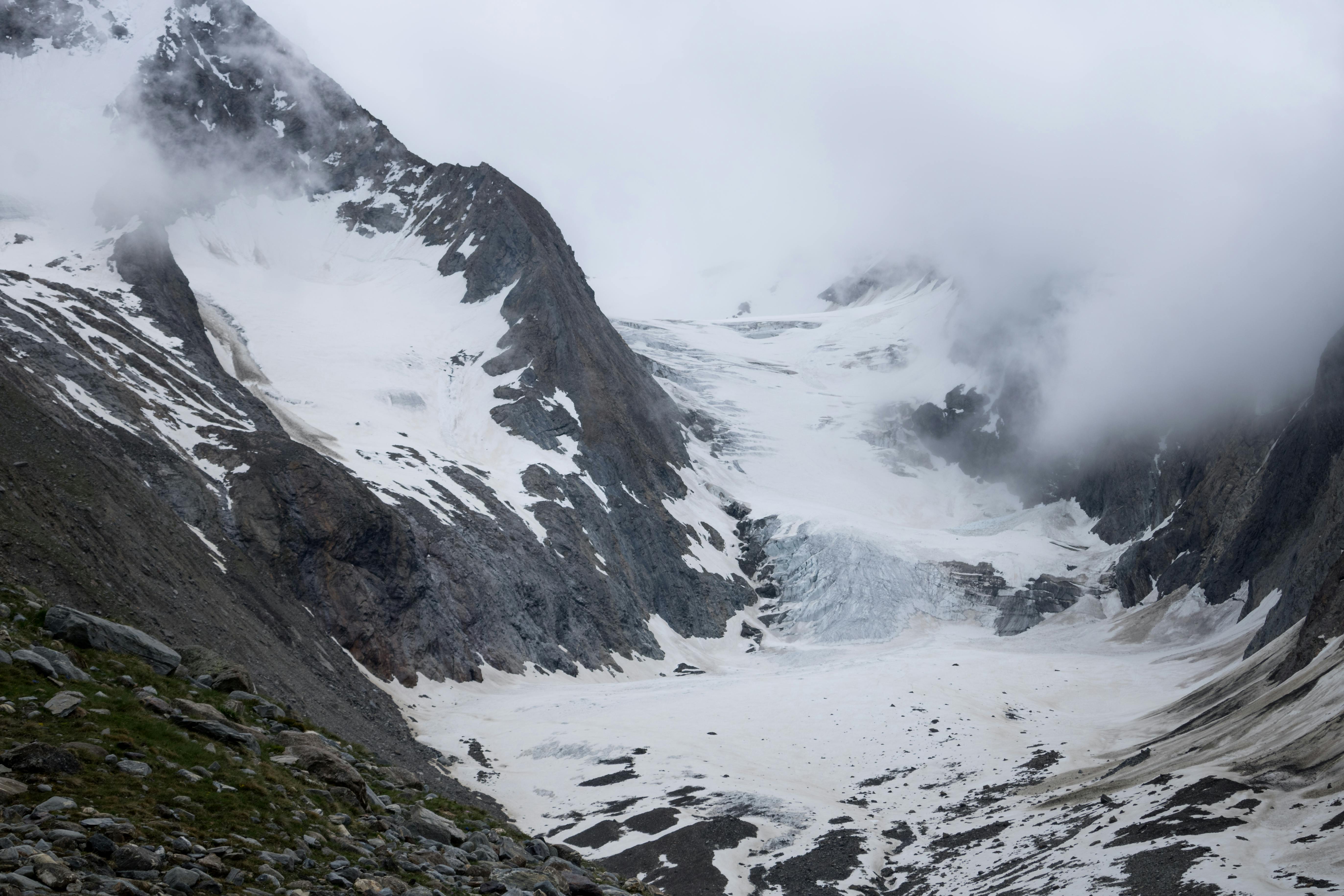 Prescription Goggle Inserts - Captivating winter landscape of the Tirol Alps, featuring snowy mountain peaks and foggy clouds.