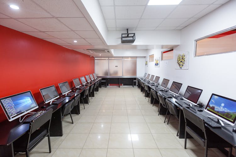 Office With Personal Computers On Tables