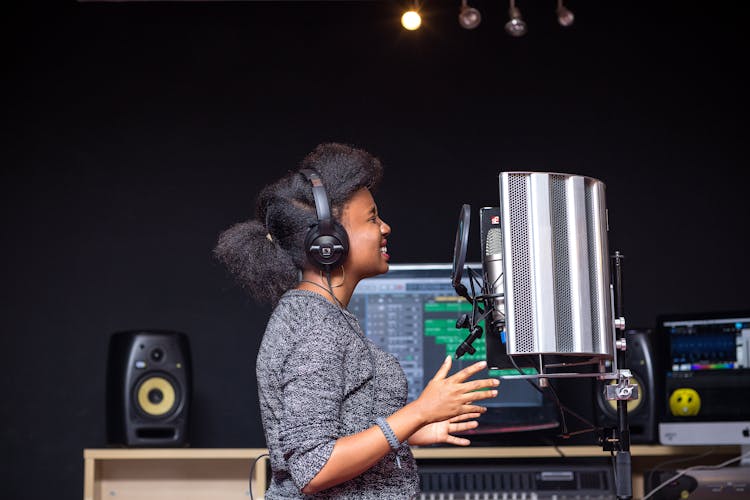 A Woman Singing In A Studio