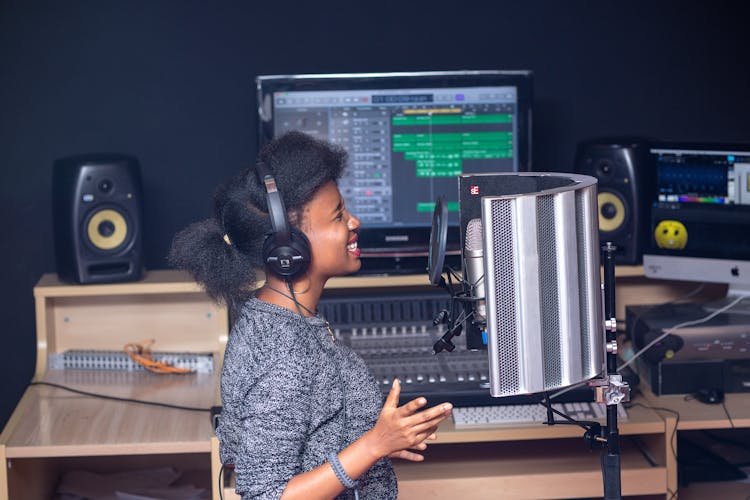 A Woman Singing In A Studio