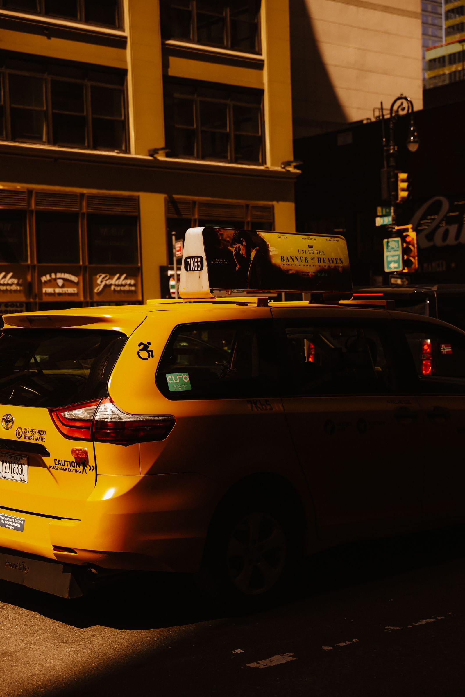 Yellow taxi outside a New York airport terminal