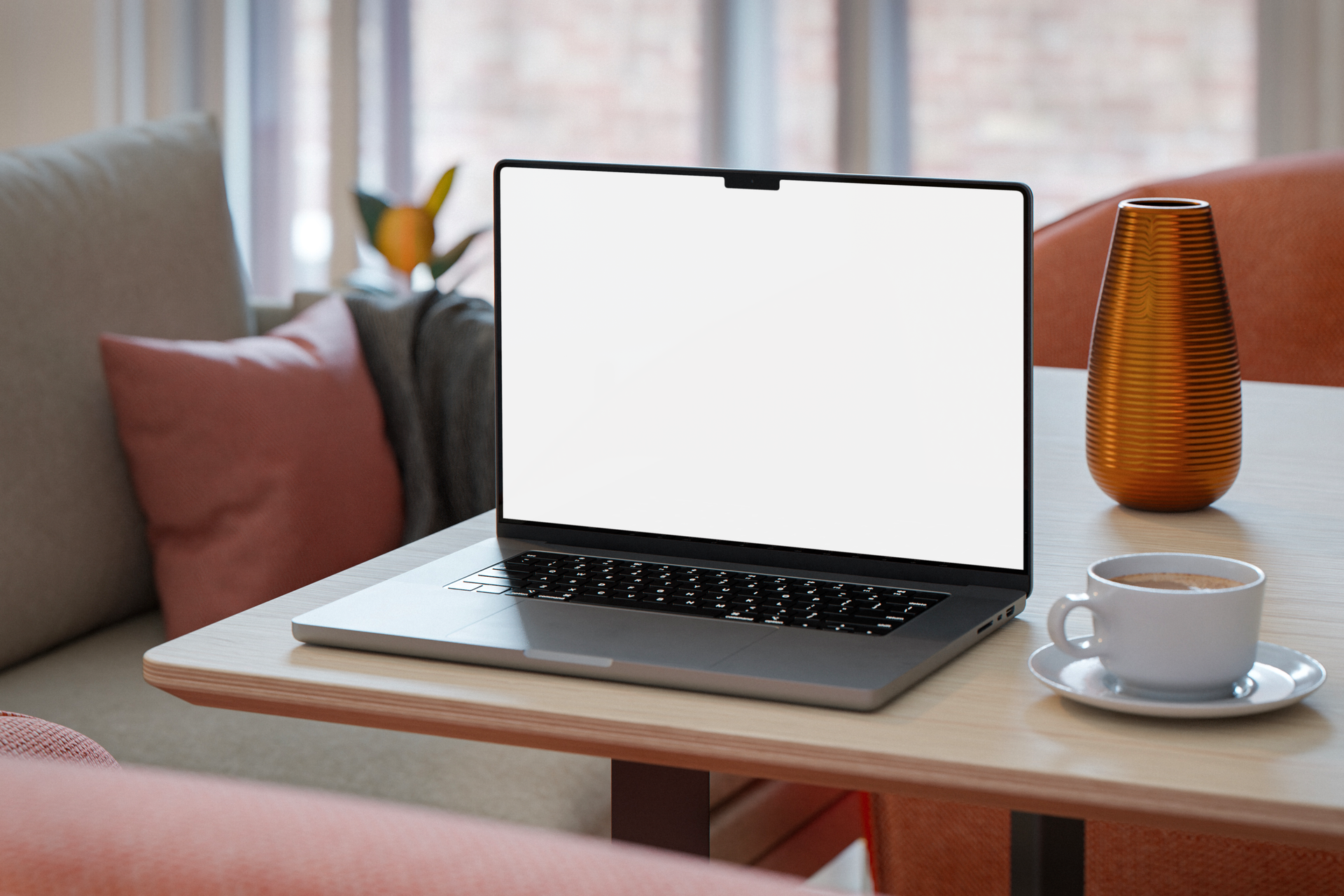 Cozy workspace with blank laptop screen and coffee on a table.