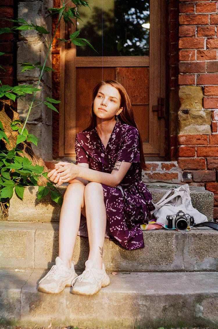 Girl Sitting On House Stairs