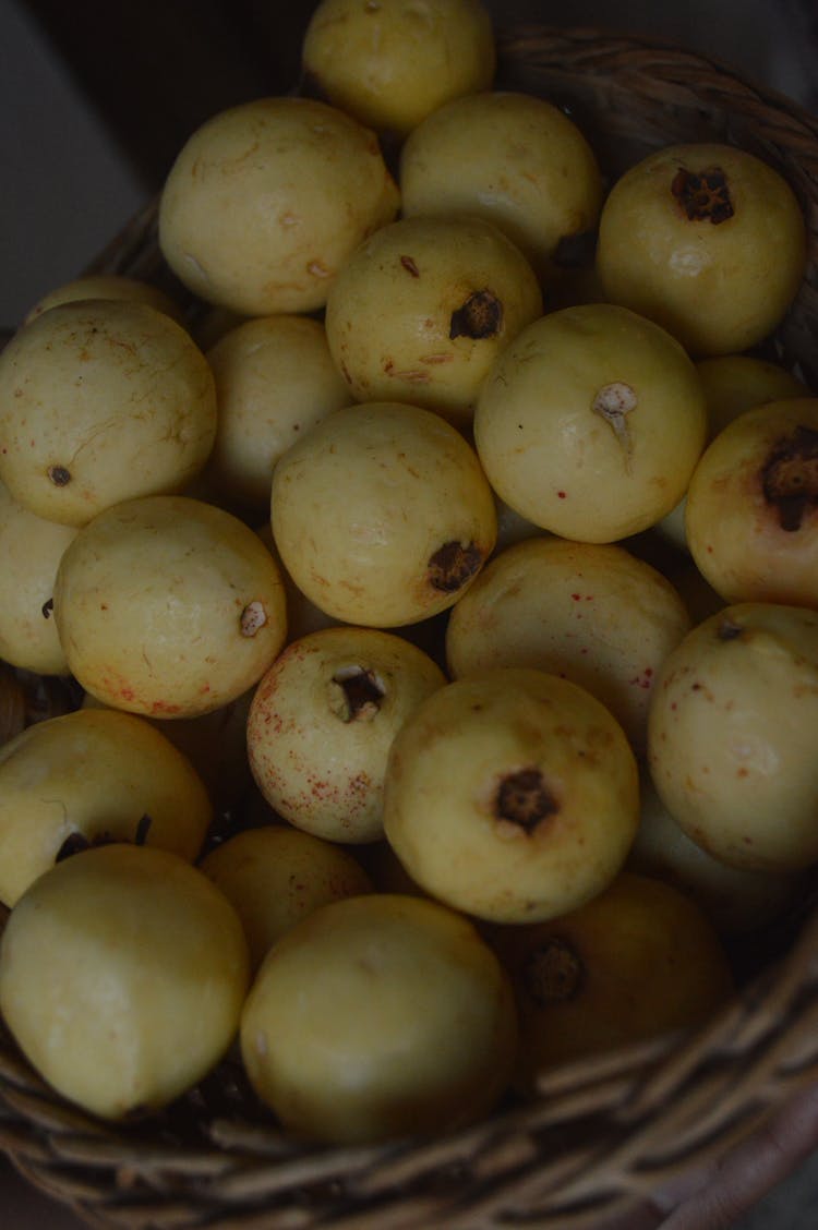 Yellow Guavas In Wicker Basket