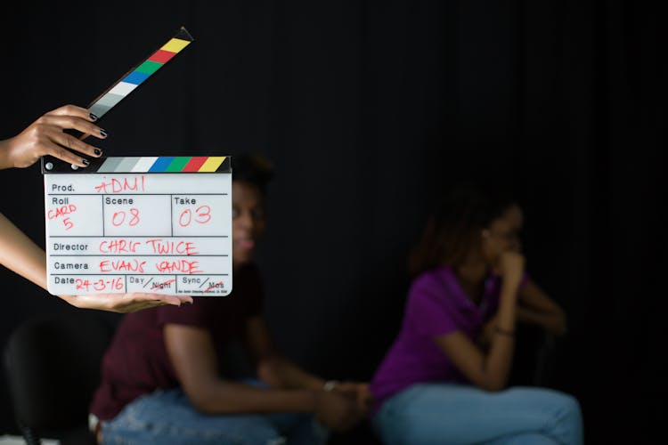 Hand Holding A Movie Clapper