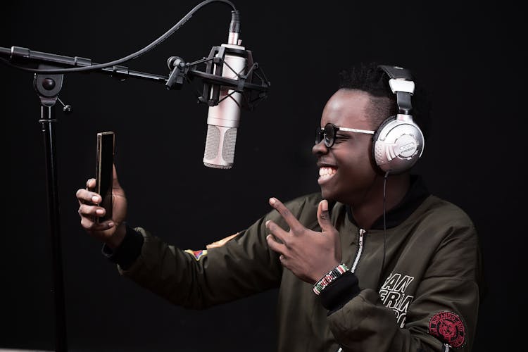 Man Smiling And Recording In Studio