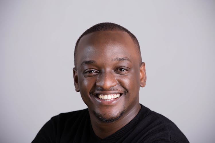 Portrait Of A Smiling Man Wearing A Black T-shirt