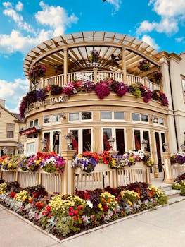 A captivating wine bar adorned with colorful flowers in an inviting garden setting.