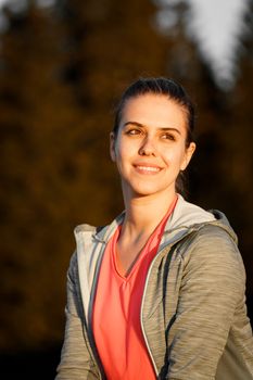 Portrait of a smiling woman enjoying the outdoors in Trentino-South Tyrol, Italy.