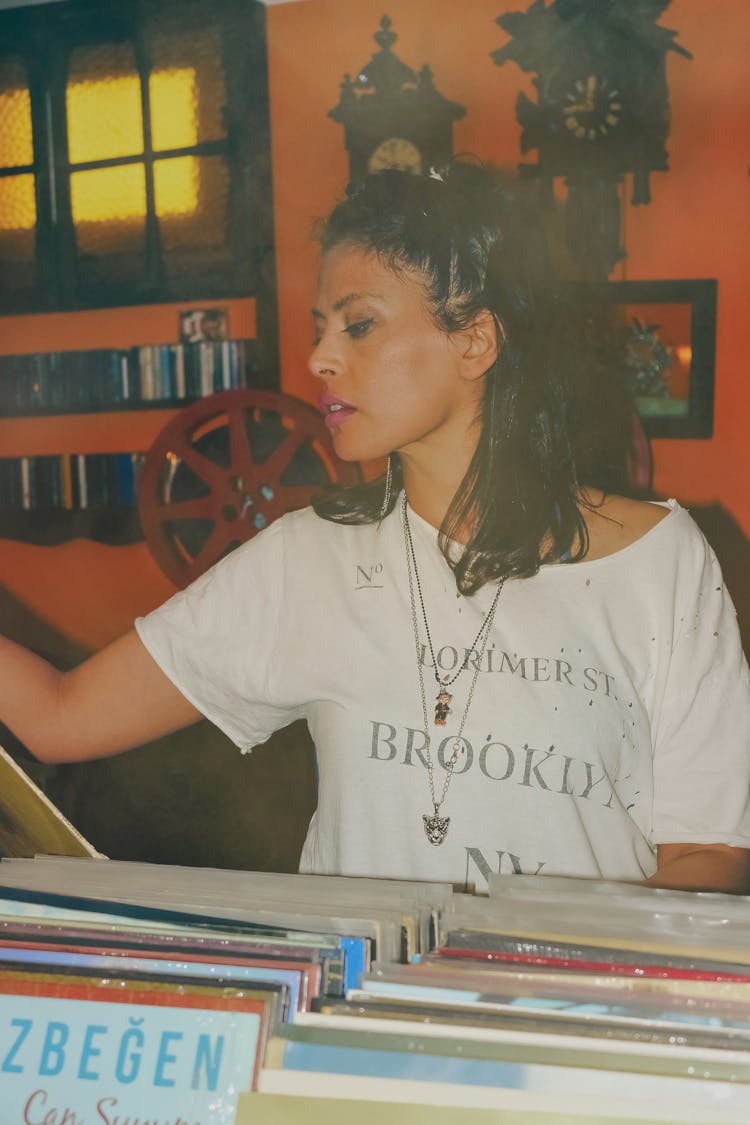 Woman In Store With Vinyl Records