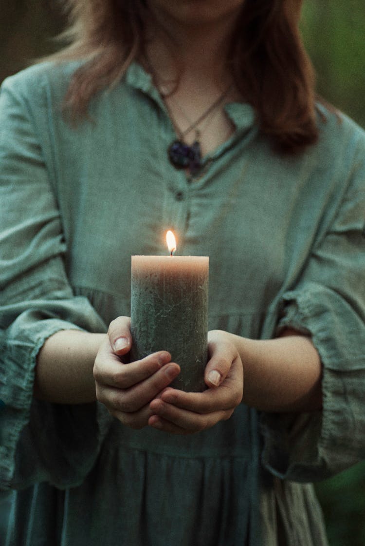 Wax Candle In Woman Hands