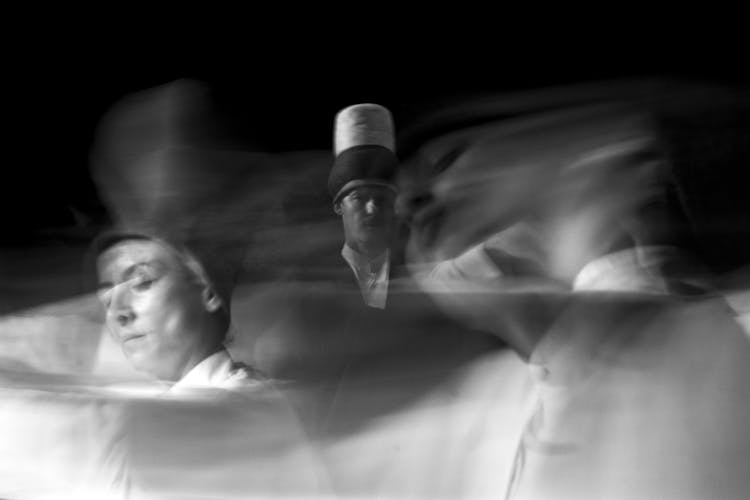 A Multiple Exposure Photo Of A Man And Woman In Grayscale Photography