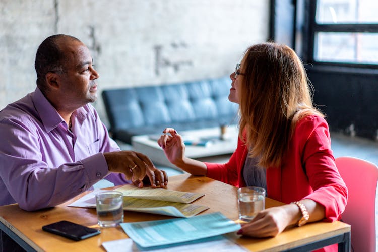 A Man And A Woman Having A Business Meeting