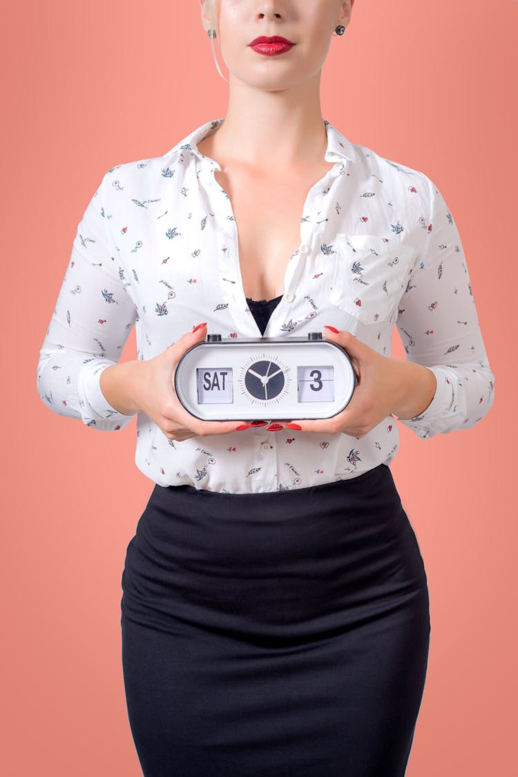 Woman Holding A Clock 