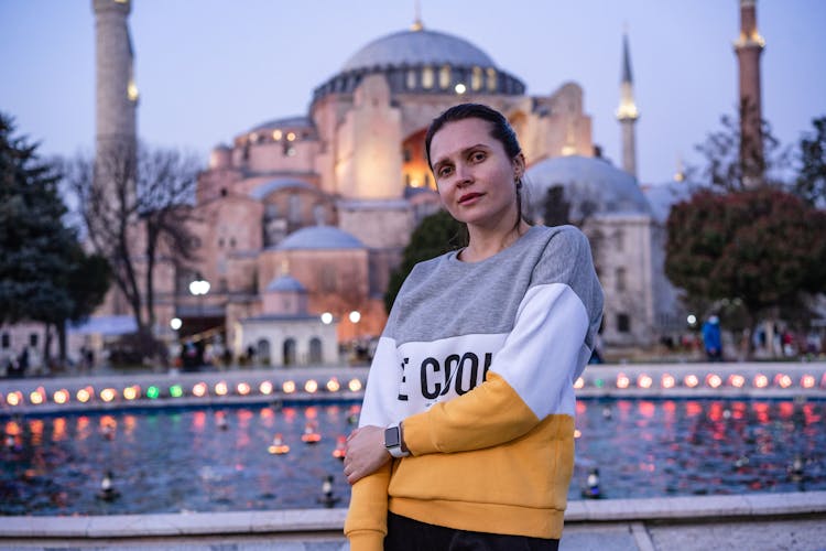 Young Woman In Front Of A Mosque