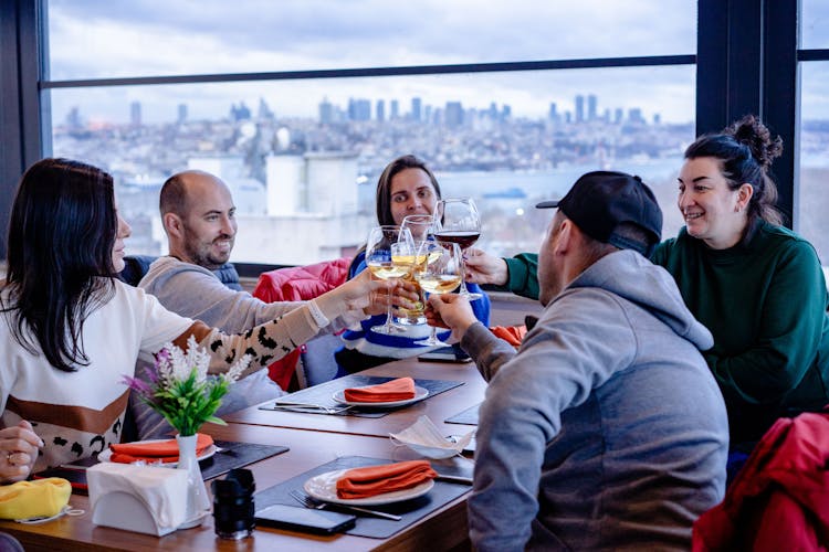 Friends Celebrating In Restaurant Together