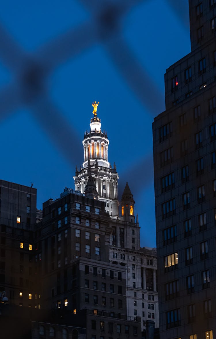 Illuminated Administration Building Tower On Night Sky