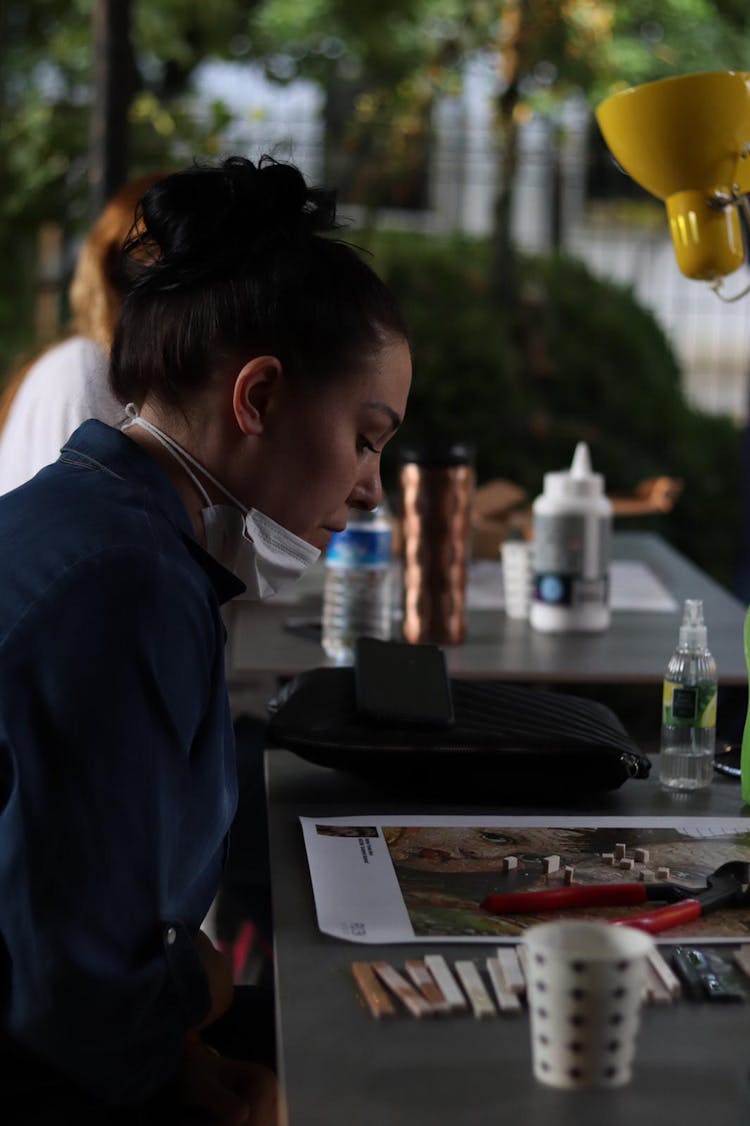 A Woman Sitting At A Table