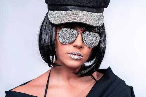 Woman Wearing Sunglasses Covered with Silver Sequence