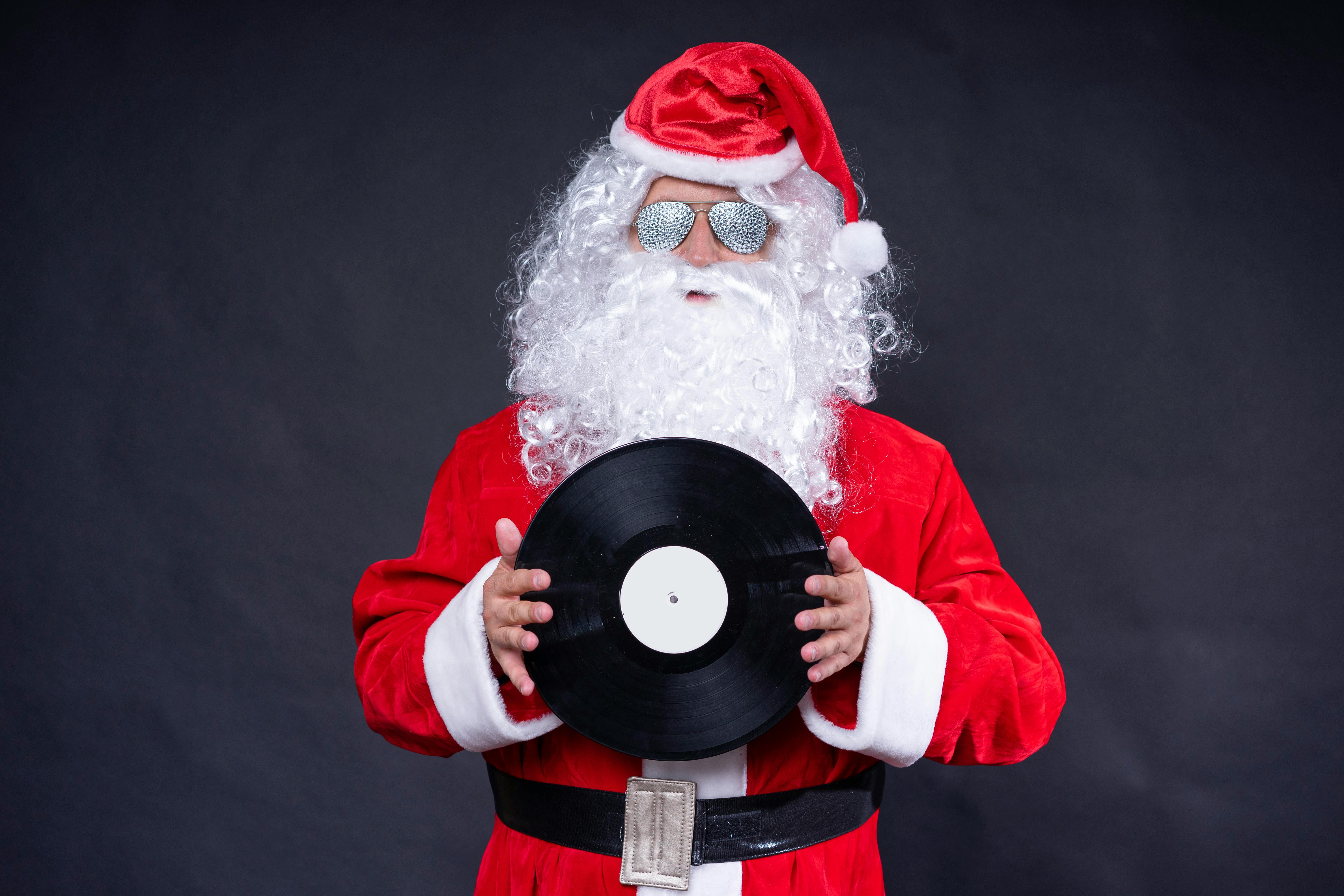 Free Santa Claus Holding a Vinyl Record Stock Photo