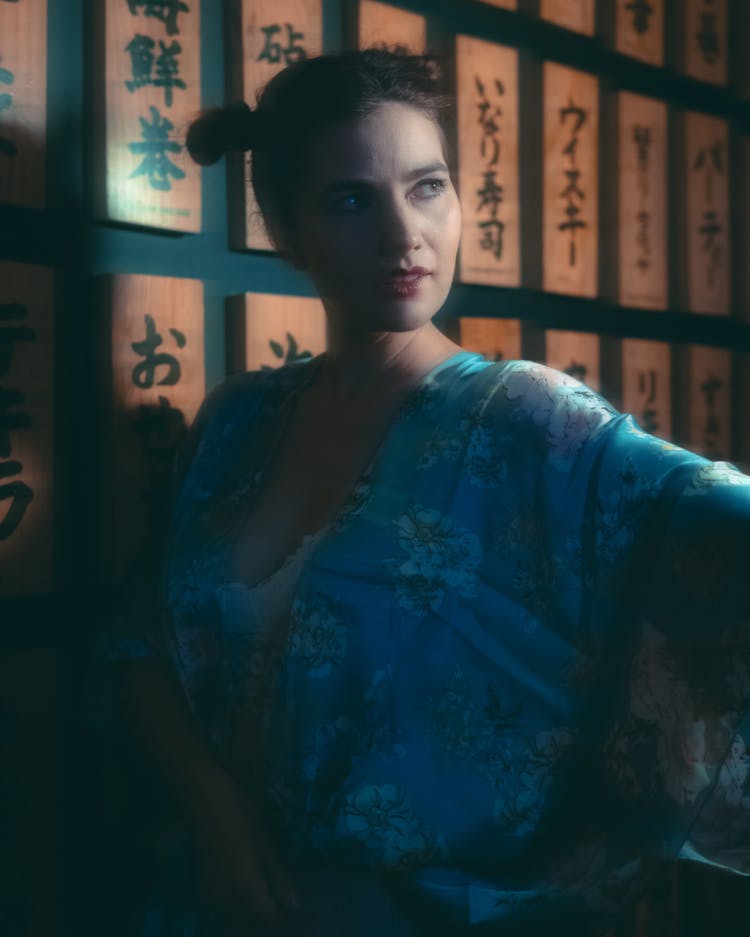 Portrait Of A Woman And Japanese Script In Background