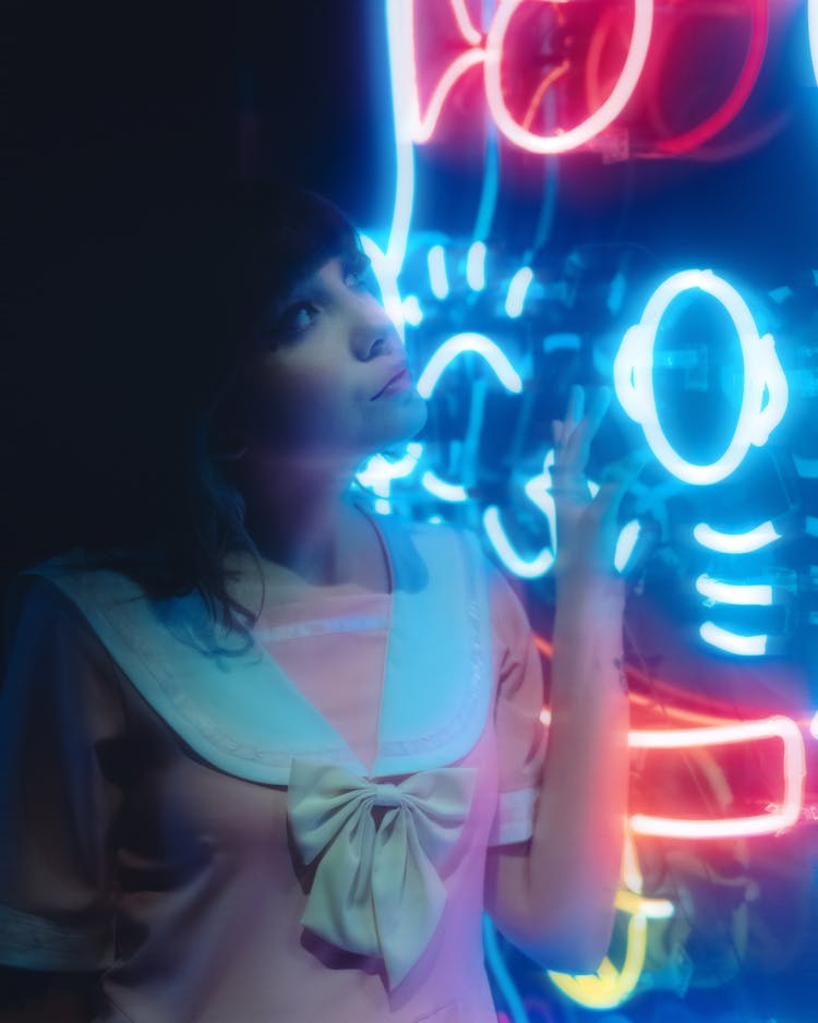 Portrait Of A Girly Woman In A Dress With A Bow And Neons