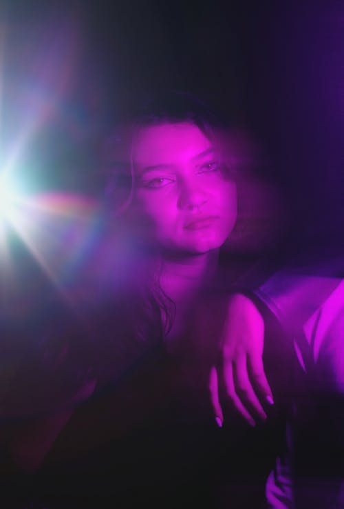 Blur Portrait of Young Woman in Dark