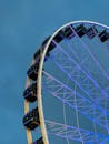 Low-Angle Shot of a Black and White Ferris Wheel
