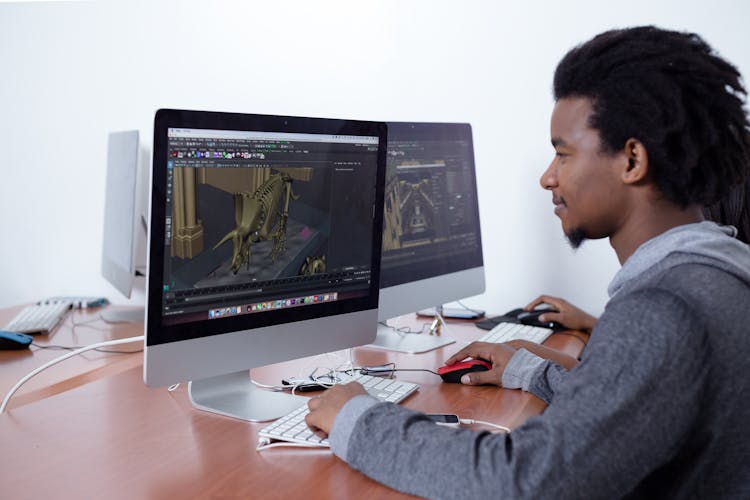 A Man Editing A Photo On His Computer