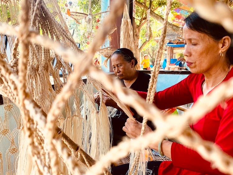 Women Weaving A Net 