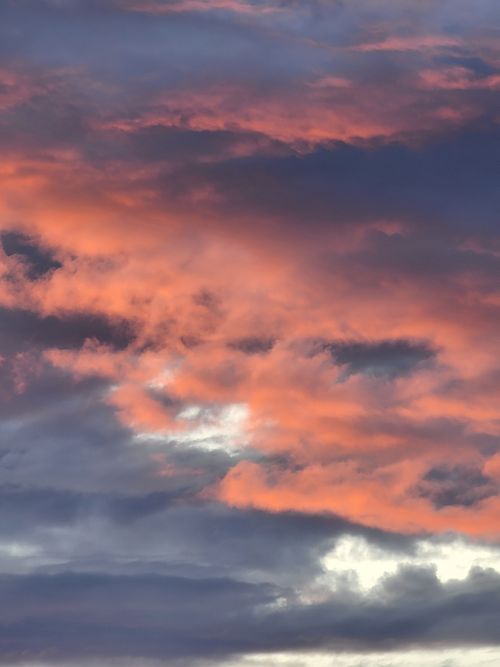 Free A captivating display of colorful clouds during a dramatic sunset, enhancing the skyscape. Stock Photo
