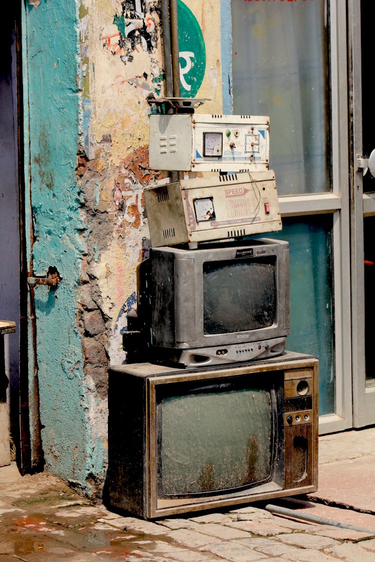 Stacks Of Vintage Box Type Televisions 