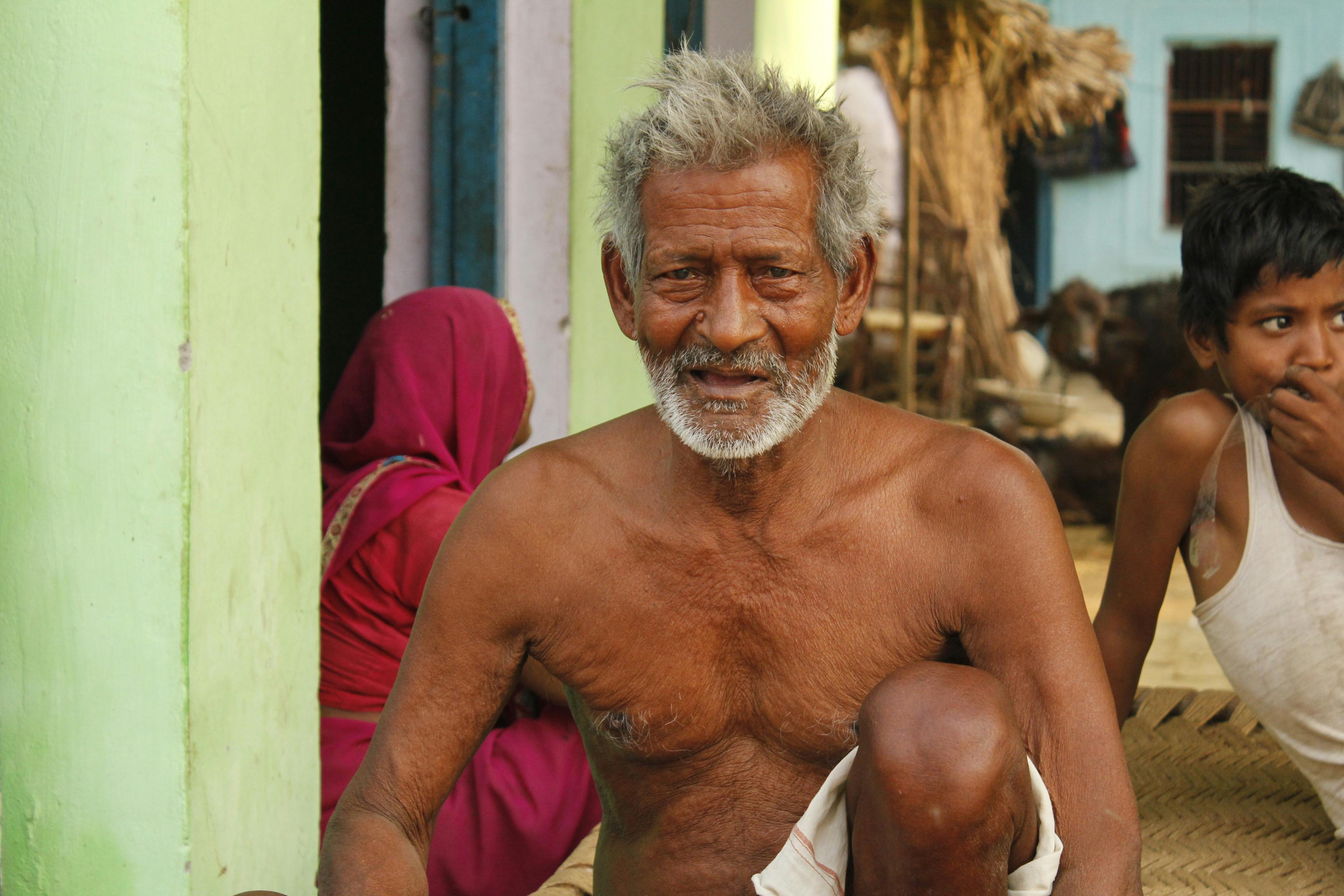 A topless, grey-haired man wearing white … – License image – 12684732 ❘  Image Professionals